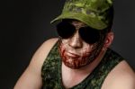 Military Style Camouflage On The Soldier's Face Stock Photo