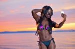 Beautiful Black African American Woman Posing On The Beach At Su Stock Photo