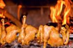 Chicken Roasting On Skewer Stock Photo