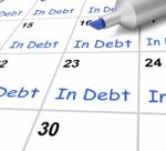 In Debt Calendar Shows Borrowed Money Owed Stock Photo