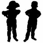 Silhouettes Of Two Little Boys Stock Photo