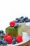 Green Tea Matcha Mousse Cake With Berries Stock Photo