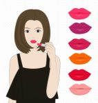 Women Applying Lipstick Stock Photo