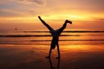 Silhouette Of Child On Beach Stock Photo