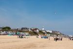 People Enjoying The Beach In Southwold Stock Photo