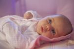 Baby Girl Rests In The Cradle Stock Photo