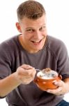 Smiling Man Eating Cornflakes Stock Photo