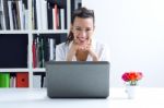 Woman With Laptop Working At Home Stock Photo