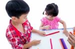 Asian Kids Playing With Play Clay On Table. Strengthen The Imagi Stock Photo