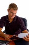 Young Male Looking In To Book Stock Photo