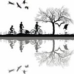 Family Cycling On Edge Of Lake Stock Photo