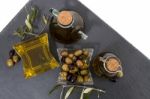 Green And Black Olives With Olive Oil Bottles Stock Photo