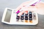 Woman's Hand With A Calculator And A Pen Stock Photo