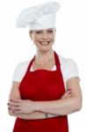 Smiling Lady Cook With Crossed Arms Stock Photo