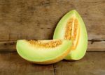 Yellow Cantaloupe Melon On The Wooden Background Stock Photo