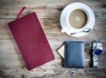 Red Book With A Purse And Credit Cards On A Wooden Background Stock Photo