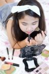 Little Girl Playing With Mothers Makeup Stock Photo