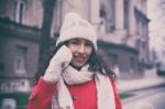 Smiling Woman In Red And Wool Cap And Gloves With Smartphone In Stock Photo