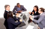 Multi Ethnic Team During Meeting Stock Photo