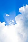 Clouds In Blue Sky With Sunbeam Stock Photo