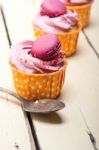 Pink Berry Cream Cupcake With Macaroon On Top Stock Photo