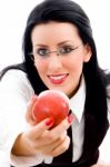 Young Woman Holding An Apple Stock Photo