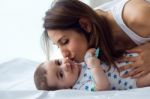 Mother And Baby Playing And Smiling At Home Stock Photo