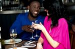 Affectionate Romantic Couple In A Bar Stock Photo