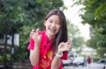 Portrait Of Thai Teen Beautiful Girl In Chinese Dress, Relax And Smile Stock Photo