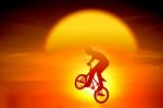 Silhouetted Bicycle Rider Stock Photo