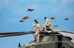 Helicopter Crew Watching The Red Arrows Display Stock Photo