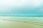 The View Of Sand Beach And Sea Wave On Afternoon Stock Photo