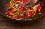 Fried Chili Pepper And Vegetable On A Wok Pan Stock Photo