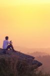 Young Man  Asia Tourist  At Mountain Is Watching Over The Misty Stock Photo