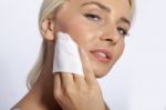 Young Woman Clean Face With Wet Wipes Stock Photo