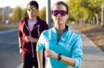 Beautiful Couple Running In The Street Stock Photo