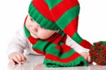 Baby With Christmas Hat And Scarf Stock Photo