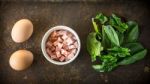 Ingredients For Florentine Eggs With Spinach On The Rusty Background Stock Photo