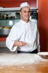 Male Chef Working In Kitchen Stock Photo