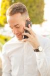 Man With Mobile Phone In Hands Stock Photo