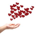 Many Red Hearts On Hand Stock Photo