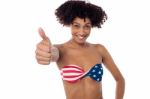 Young Woman In Bikini Showing Thumb Up Stock Photo