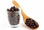 Coffee Beans In Glass And Spoon Stock Photo