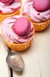 Pink Berry Cream Cupcake With Macaroon On Top Stock Photo