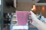 Woman Hands Holding Coffee Cup With Blurred Coffee Shop Stock Photo