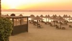 Tropical Beach Huts At Sunrise Stock Photo