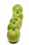 Row Of Fresh And Healthy Green Apples Stock Photo