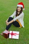 Santa Claus Hat With Red Christmas Gift Box Stock Photo