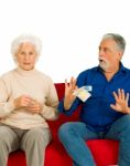 Elderly Couple Holding Money Stock Photo