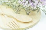 Wooden Set Of Food Utensil And Static Flower Stock Photo